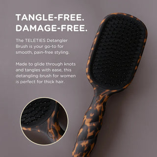TELETIES Detangler Brush with tortoiseshell handle on a gray background