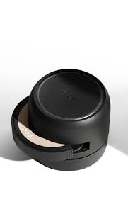 Black container with a lid on a white background