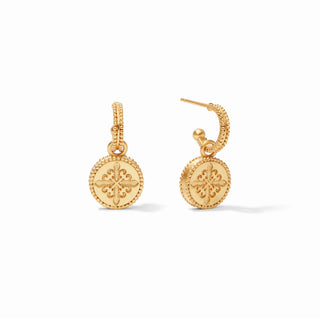 Gold earrings with intricate designs on a white background