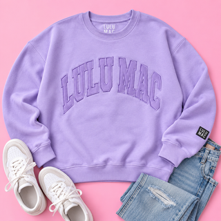 lavender purple crewneck sweatshirt with 'LULUMAC' printed in arched letters on the chest