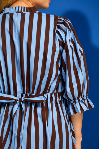 a brown and light blue vertically striped shirt dress with puff sleeves and a buttoned collar