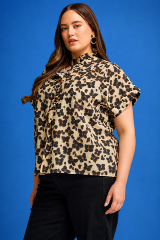 Ruffle Mock Neck Button top ,100%cotton with a ruffle neckline, button front, and elegant butterfly-inspired print.