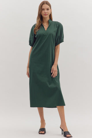 Woman wearing a green dress on a white background