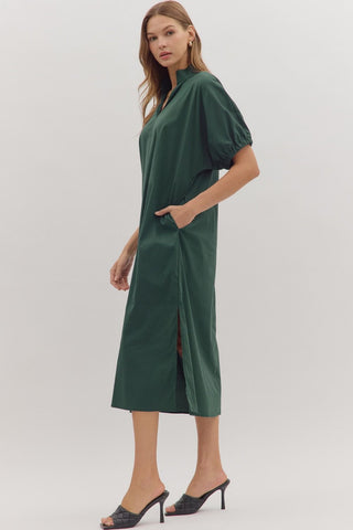 Woman wearing a green dress on a white background