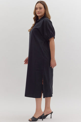 Woman wearing a black dress on a white background