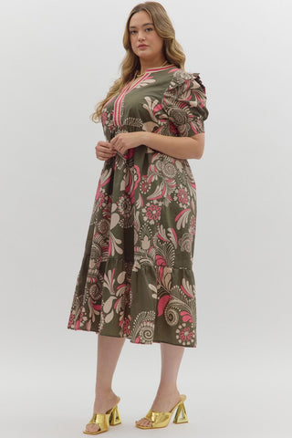 Woman wearing a patterned dress on a white background