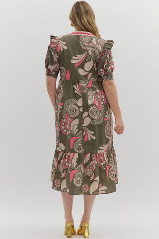 Woman wearing a patterned dress on a white background