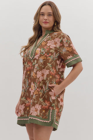 Woman wearing a floral dress with a brown background