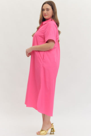 Woman wearing a pink dress on a white background