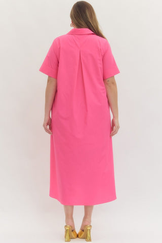Woman wearing a pink dress against a white background