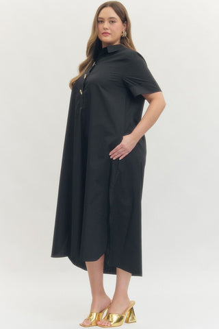 Woman wearing a black dress with a white background