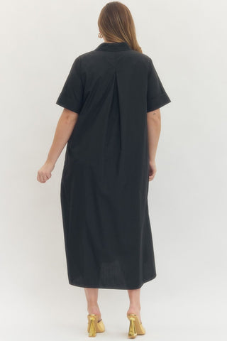 Black dress worn by a person on a white background