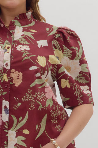 Red floral blouse with puff sleeves on a white background