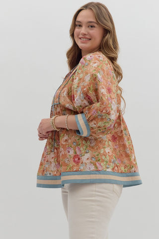 Woman wearing a floral blouse with a white background