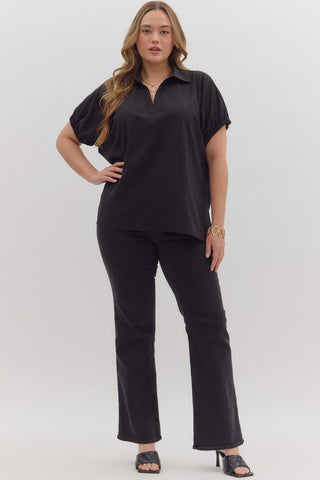 Woman wearing a black outfit on a white background