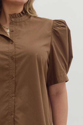 Brown button-up shirt worn by a person on a white background