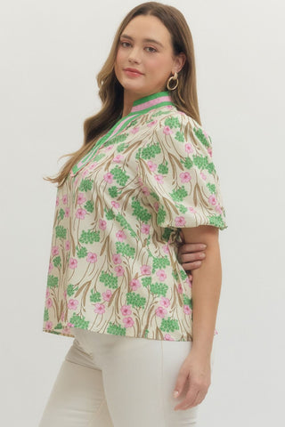 Woman wearing a floral blouse with a white background