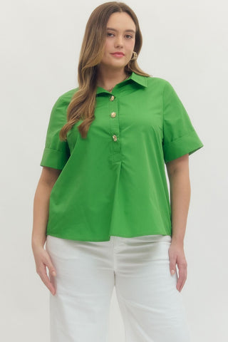 Woman wearing a green blouse with gold buttons on a white background