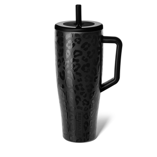 Black leopard print mug with handle and straw lid on a white background