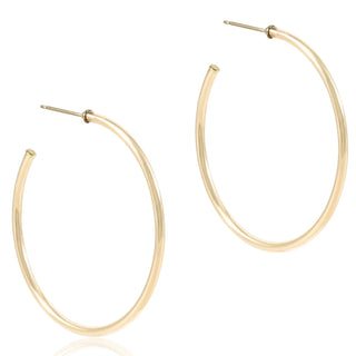 Gold hoop earrings on a white background