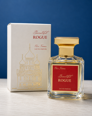 Perfume bottle and packaging of 'Beautiful Rogue' on a blue background