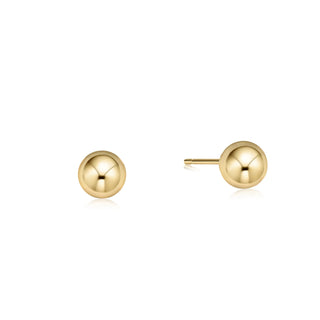eNewton Classic Gold Ball Stud Earrings featuring polished gold-filled ball studs with secure post backs, minimalist everyday earrings shown on a jewelry card and worn in an ear piercing.