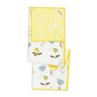 Set of two kitchen towels with floral and polka dot patterns on a white background