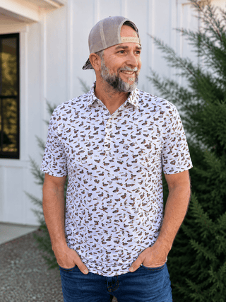 Duck & Call Polo featuring a duck and duck call print, stretch performance fabric, polo collar, and breathable comfort.