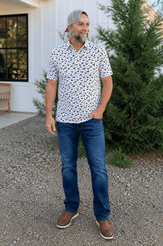 Duck & Call Polo featuring a duck and duck call print, stretch performance fabric, polo collar, and breathable comfort.