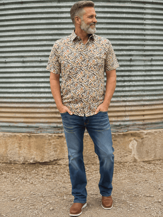 Duck Camo Polo featuring a duck camo print, stretch performance fabric, polo collar, and breathable all-day comfort.
