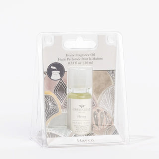 Home fragrance oil bottle in packaging with geometric design