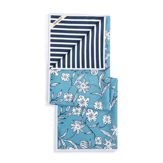 Two folded towels with striped and floral patterns on a white background