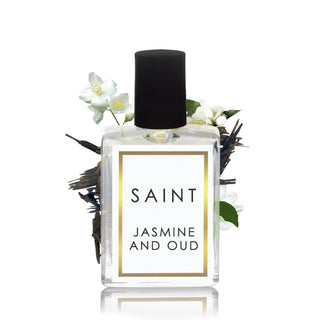 Perfume bottle labeled 'Saint Jasmine and Oud' with flowers and feathers on a white background