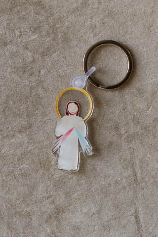 Keychain with angel design on a textured surface
