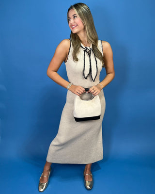 eek ribbed knit silhouette, this elevated maxi dress features a chic sleeveless design and a removable contrast neck tie