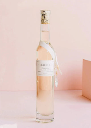 Bottle of Lollia Rosé wine on a light pink background