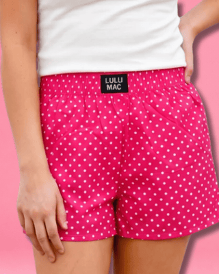 Polka Dot Boxer Shorts featuring a pink and white polka dot print, 100% cotton, elastic waistband, and relaxed fit.