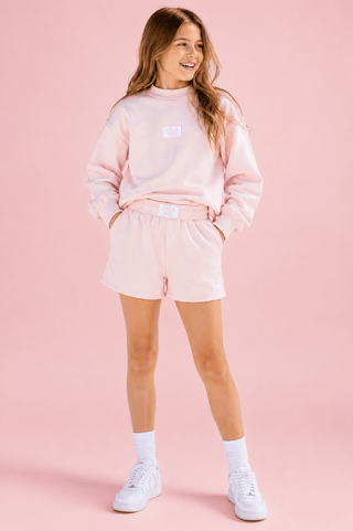 Youth Cloud Soft Shorts featuring a cotton blend, terry interior, elastic waistband, pockets, and relaxed fit.