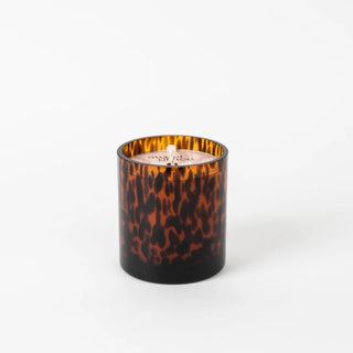 Candle with tortoiseshell pattern on a white background