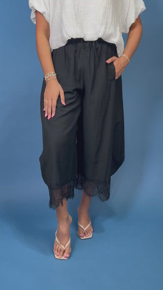 Drawstring Lace Hem Pants featuring a relaxed fit, elastic drawstring waist, and elegant lace hem