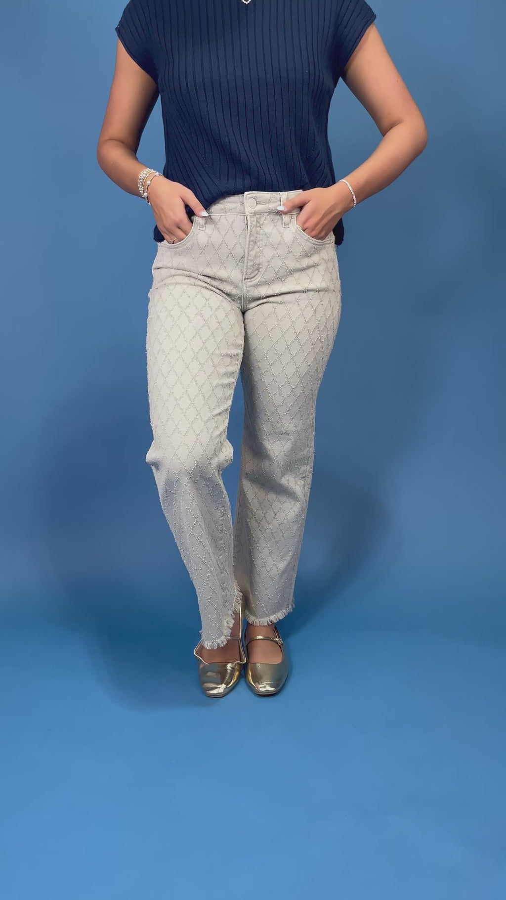 light gray patterned denim jeans with a textured geometric design