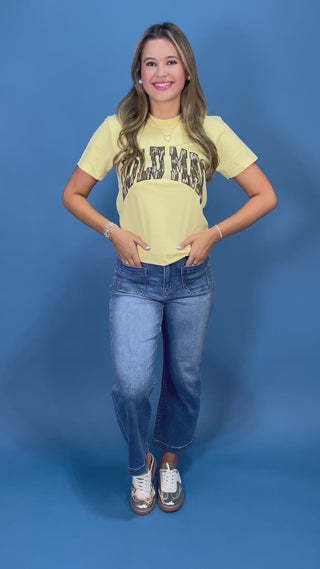a pale yellow t-shirt with 'LULU MAC' printed in camo across the chest