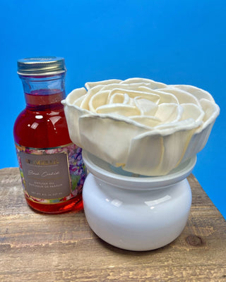 white ceramic vase, decorative floral gift box, and premium Black Orchid diffuser oil for elegant home fragrance.