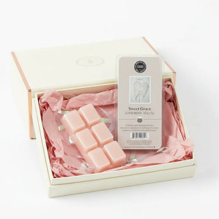 Pink wax melts in a decorative box with a 'Sweet Grace' label on a white background