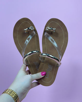 The Ariana Gold Detail Clear Sandal - All About You