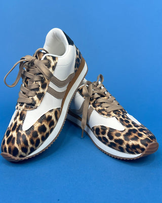 A pair of low-top sneakers featuring a leopard print pattern on the toe and eyestay panels, white leather overlays, an