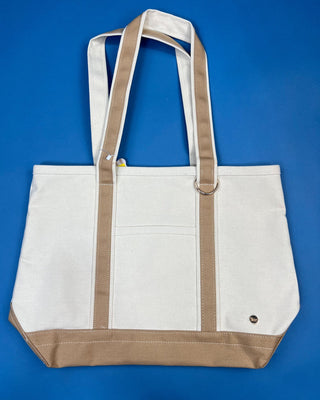 Large heavyweight canvas tote bag with contrast trim, reinforced shoulder straps, exterior slip pocket, and spacious interio