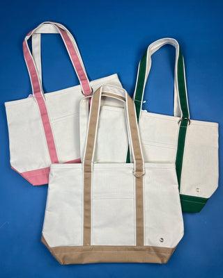 Large heavyweight canvas tote bag with contrast trim, reinforced shoulder straps, exterior slip pocket, and spacious interior