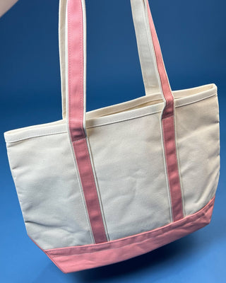 Large heavyweight canvas tote bag with contrast trim, reinforced shoulder straps, exterior slip pocket, and spacious
