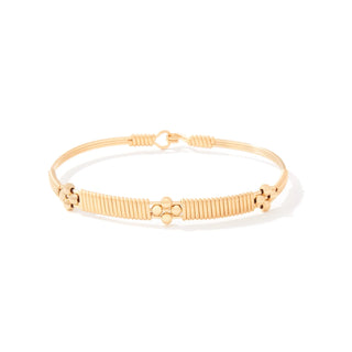 Gold bracelet on a white background